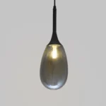Modern smoked drop glass pendant lamp for kitchen islands, dining rooms, and luxury interiors – stylish hanging light fixture with smoky grey finish and ambient LED glow.