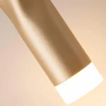 Modern gold twisted pendant light, brass finish, cylindrical hanging lamp.