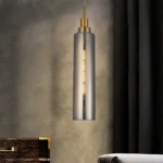 Helios luxury clear glass tube pendant light for kitchen, Modern gold finish elongated glass cylinder pendant, Single drop tube pendant light for high ceilings, Contemporary minimalist glass pendant lamp, Premium brass and glass hanging fixture