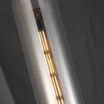 Helios luxury clear glass tube pendant light for kitchen, Modern gold finish elongated glass cylinder pendant, Single drop tube pendant light for high ceilings, Contemporary minimalist glass pendant lamp, Premium brass and glass hanging fixture