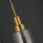 Helios luxury clear glass tube pendant light for kitchen, Modern gold finish elongated glass cylinder pendant, Single drop tube pendant light for high ceilings, Contemporary minimalist glass pendant lamp, Premium brass and glass hanging fixture